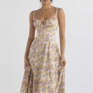 Close-up of floral print dress with pleated bustier and delicate bow tie detail