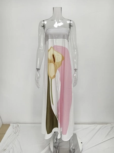 Detail of white strapless maxi dress featuring vibrant calla lily floral print patterns
