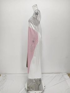 Side view detail of a strapless bodycon dress featuring pink and white geometric color blocks