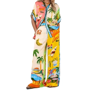 Women's tropical vacation set with zip-front shirt and wide-leg trousers in yellow print