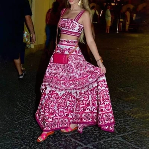 Detail of fuchsia geometric print two-piece set with square neck top and maxi skirt