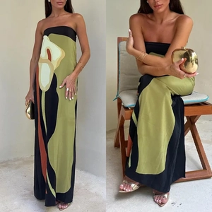 Detail of strapless maxi dress featuring abstract floral calla lily print in olive and brick