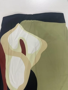 Detailed view of the lightweight fabric with abstract geometric patterns and color blocking