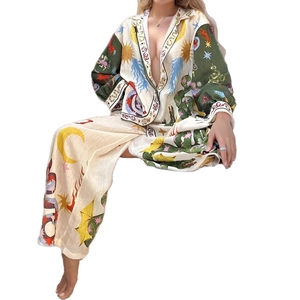 Women's chic two-piece set featuring long sleeve astrological print shirt and wide-leg trousers
