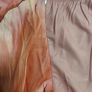Detail of floral print fabric stitched with pink satin and an invisible zipper closure