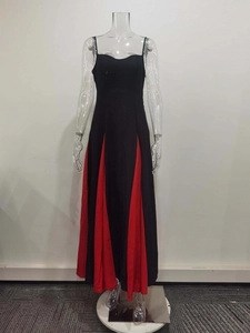 Detail of elegant backless dress with a striking black and red color-block hemline