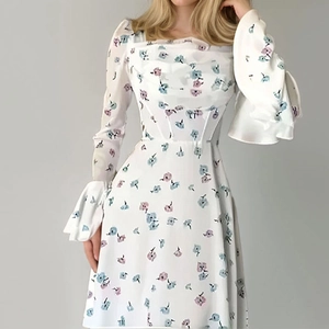 Elegant floral long sleeve dress with square neck and flared cuffs for a chic look
