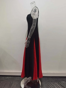 Detail of the backless slim-fit dress featuring red pleated fabric and large hem curve