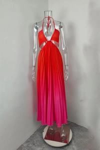 Detail of gradient pleated maxi dress featuring halter neck and waist cut-outs