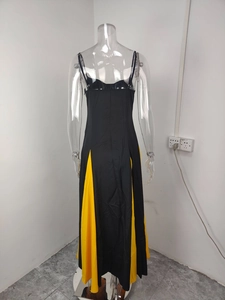 Detail of the backless A-line dress featuring yellow contrast side panels and thin straps