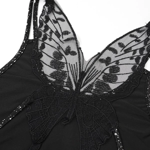 Détail de la broderie complexe de papillon noir sur la robe de soirée dos nu sexy