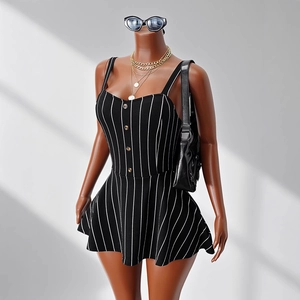 Detail of a pinstriped halter romper with a button-up front on a mannequin display