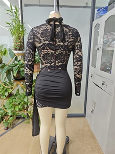 Close-up of the black floral lace sleeves and back ruching detail on the bodycon dress