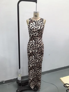Detail view of leopard print sleeveless bodycon dress fabric and tight fit silhouette