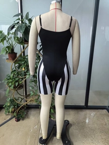 Back view of a slim fit black and white vertical striped bodysuit with spaghetti straps