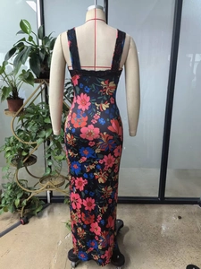 Detail of floral V-neck dress featuring delicate black lace trim and vibrant summer prints