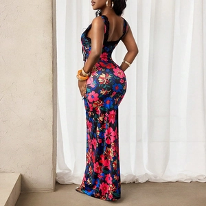 Detail of slimming floral maxi dress featuring vibrant patterns and elegant backless cut