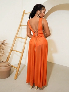 Elegant orange backless maxi dress with multi-strap detail and flowing long silhouette