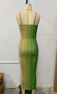 Detail of slim-fit bodycon dress featuring vertical color-block stripes and thin straps