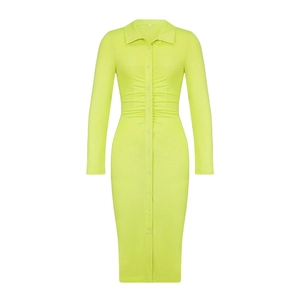 Detail view of ruched waist design on fluorescent green long sleeve knit midi dress
