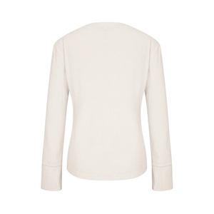 Detail view of the back of a cream waffle knit long sleeve tee with ribbed cuffs