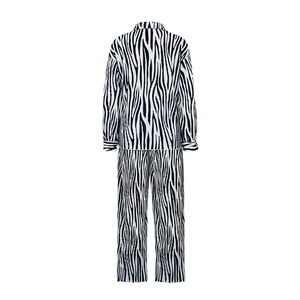 Back view of long-sleeve pleated zebra print shirt and wide-leg trousers set