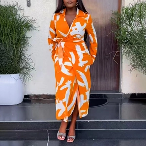Women's orange printed wrap dress with V-neck and tie waist for a casual summer style