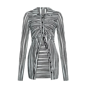 Detailed view of striped long sleeve top featuring classic collar and pleated buttons