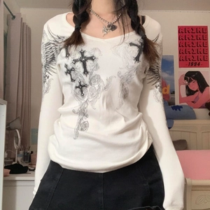 Detail of white ribbed long sleeve tee featuring Gothic cross and wing screen print