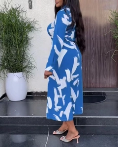 Side view of long-sleeved midi dress with blue and white abstract brushstroke pattern