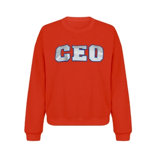 Detailed close-up of the CEO silver letter print on a bright red crewneck sweatshirt