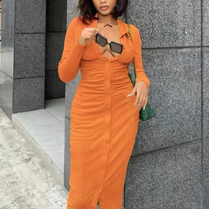 Detail of orange midi knit dress featuring V-neckline with buttons and ruched fabric