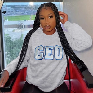 Detail of the CEO print design on this grey long sleeve crewneck sweatshirt for women