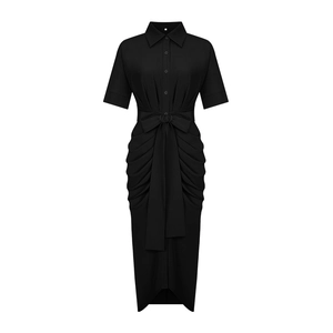 Detail of black polo neck shirt dress showing ruched side seams and waist tie bow