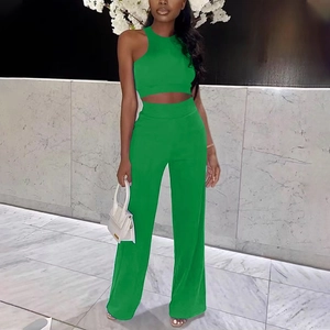 Women's bright green two-piece set featuring a sleeveless crop top and high waist wide leg pants