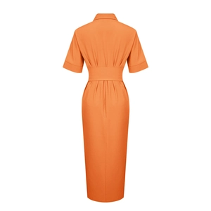 Back view of orange short sleeve polo shirt dress showing pleated high waist detail