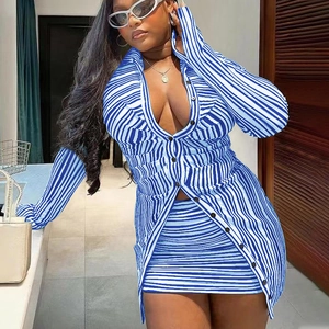 Detail view of the deep V-neck and button closure on striped long sleeve two-piece set