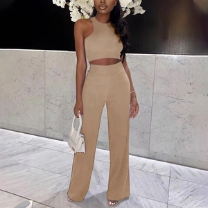 Detail of khaki two-piece set featuring a sleeveless crop top and wide-leg trousers
