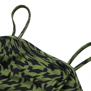Detail of thin dual shoulder straps and geometric patterns on camisole neckline