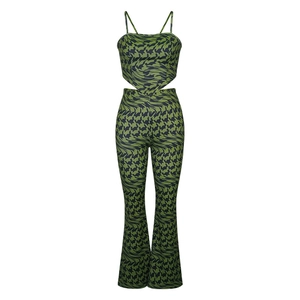 Detail of printed camisole and flare pants set with green geometric patterns