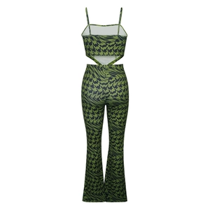 Back view of a printed camisole and flare pants set with green distorted houndstooth pattern