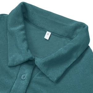 Macro shot of teal knit dress collar with ribbed texture and size S tag detail