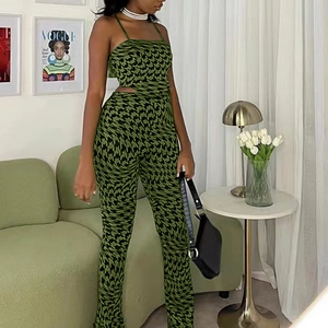 Detail of the green houndstooth print on the crop top and high-waisted trousers set