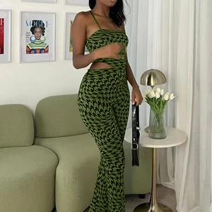 Detail view of stylish green geometric star print crop top and wide leg pants set