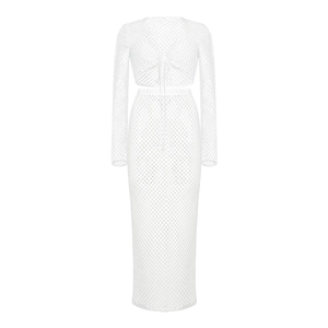 Close-up of white mesh knit two-piece set with drawstring crop top and maxi skirt