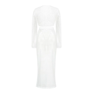 Detail of white two-piece knit set showing diamond mesh texture on long sleeve top and skirt