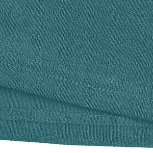 Macro shot showing double-needle stitching and turquoise knit fabric texture details