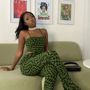 Women's two-piece knit set featuring green houndstooth crop top and high-waist trousers