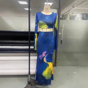 Two-piece abstract print set featuring a long sleeve crop top and high waist maxi skirt
