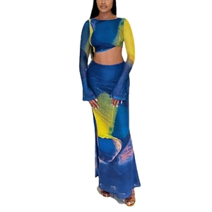 Women's two-piece set featuring long sleeve crop top and high-waist skirt in artistic print